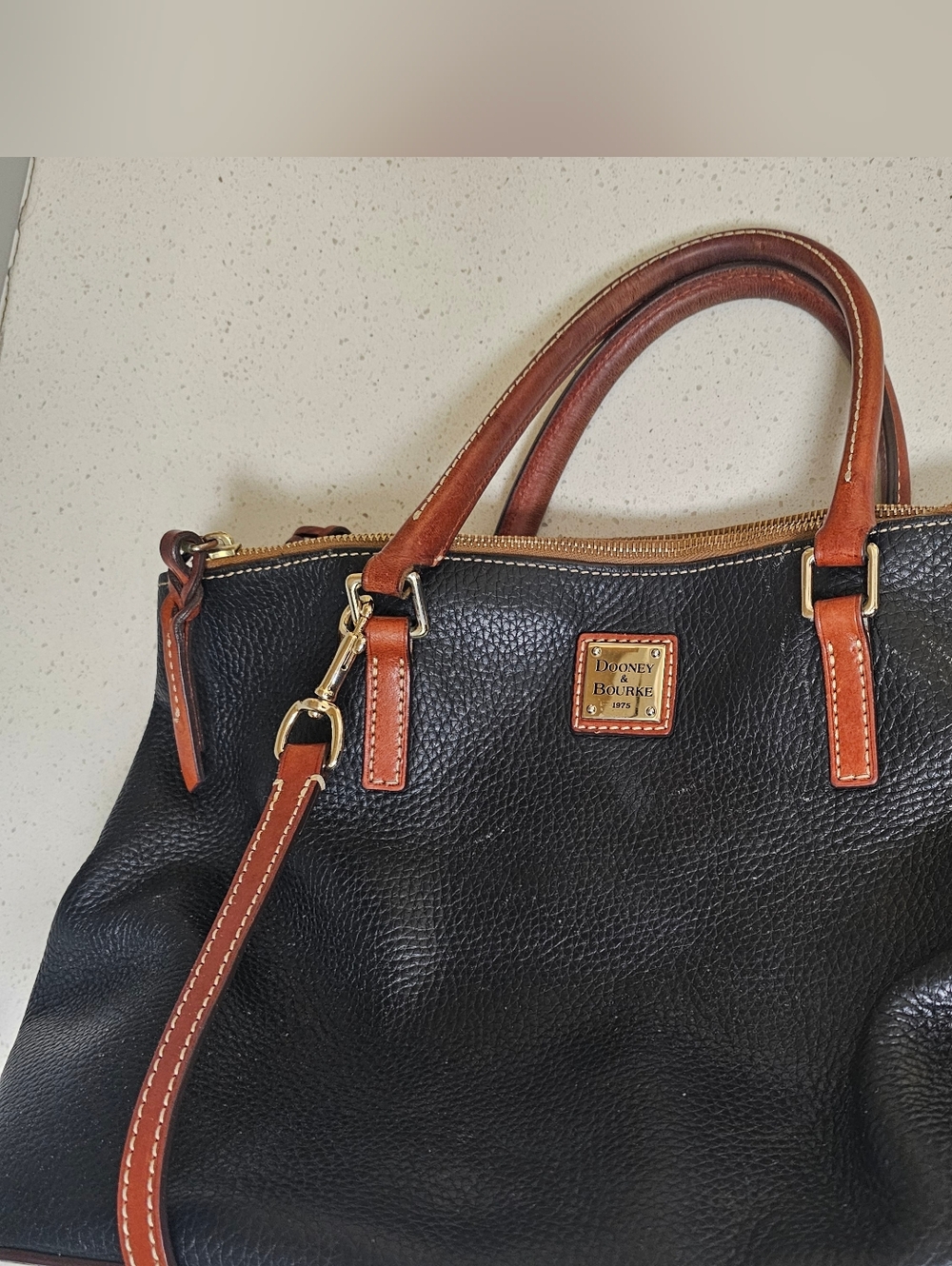 Dooney & Bourke Black Leather Satchel with Brown Trim and Gold Hardware